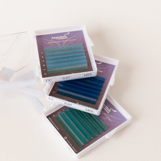 Angelash_color_eyelash_extensions_trays_in_blue_and_green_shades_displayed_in_clear_cases