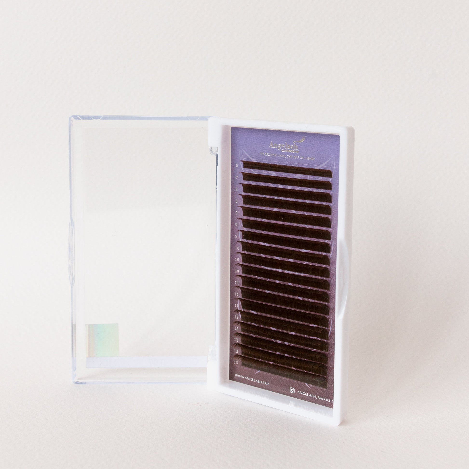 Angelash_eyelash_extensions_tray_displayed_in_open_clear_case_on_light_background