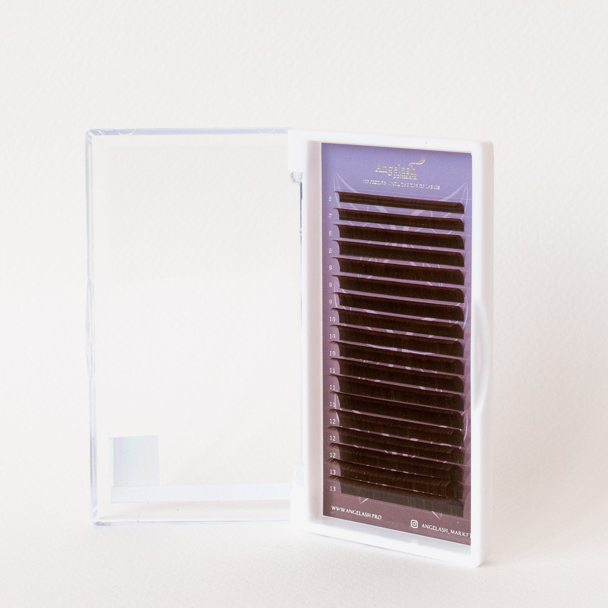 Angelash_eyelash_extensions_tray_displayed_inside_open_clear_case_on_light_background