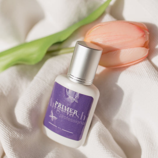 Angelash_lash_primer_bottle_with_tulip_on_white_fabric