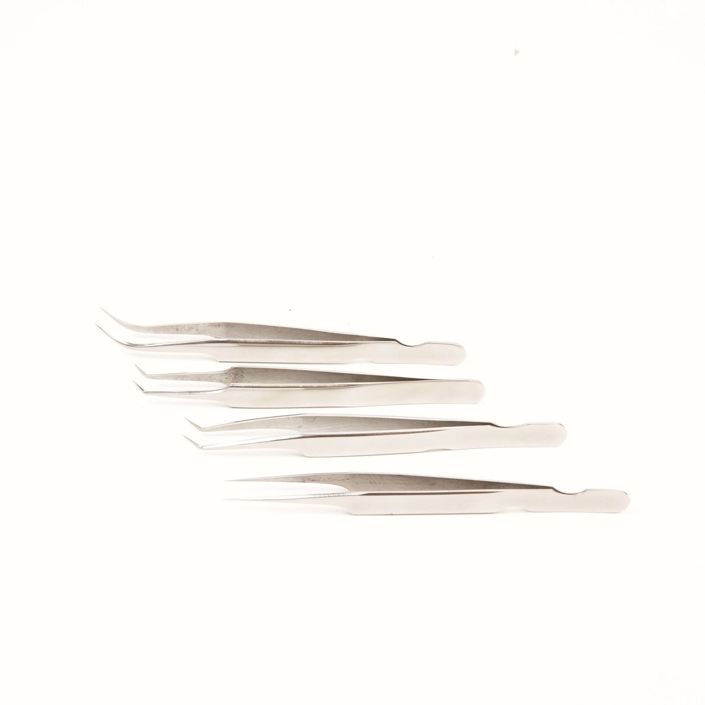 Angelash_silver_tweezers_set_on_white_background